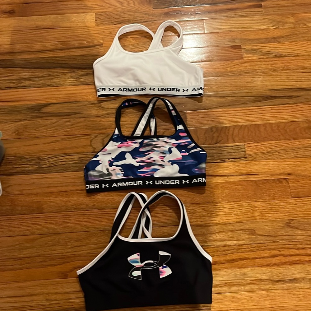 Three bras with no pads have never been worn but no tags with a crossover strap